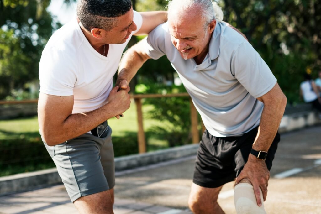 Man holding his knee in pain