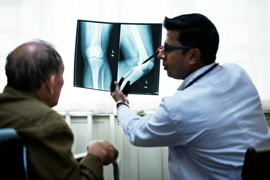 Orthopedic doctor discussing treatment options with patient
